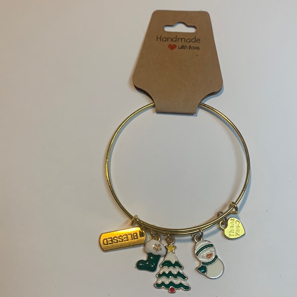 Handmade gold tone stainless steel bracelet with 5 charms.